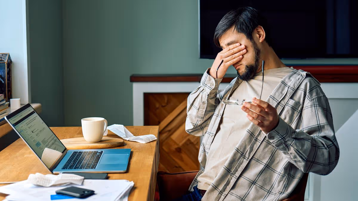 Man Struggles With Noisy Neighbors While Working