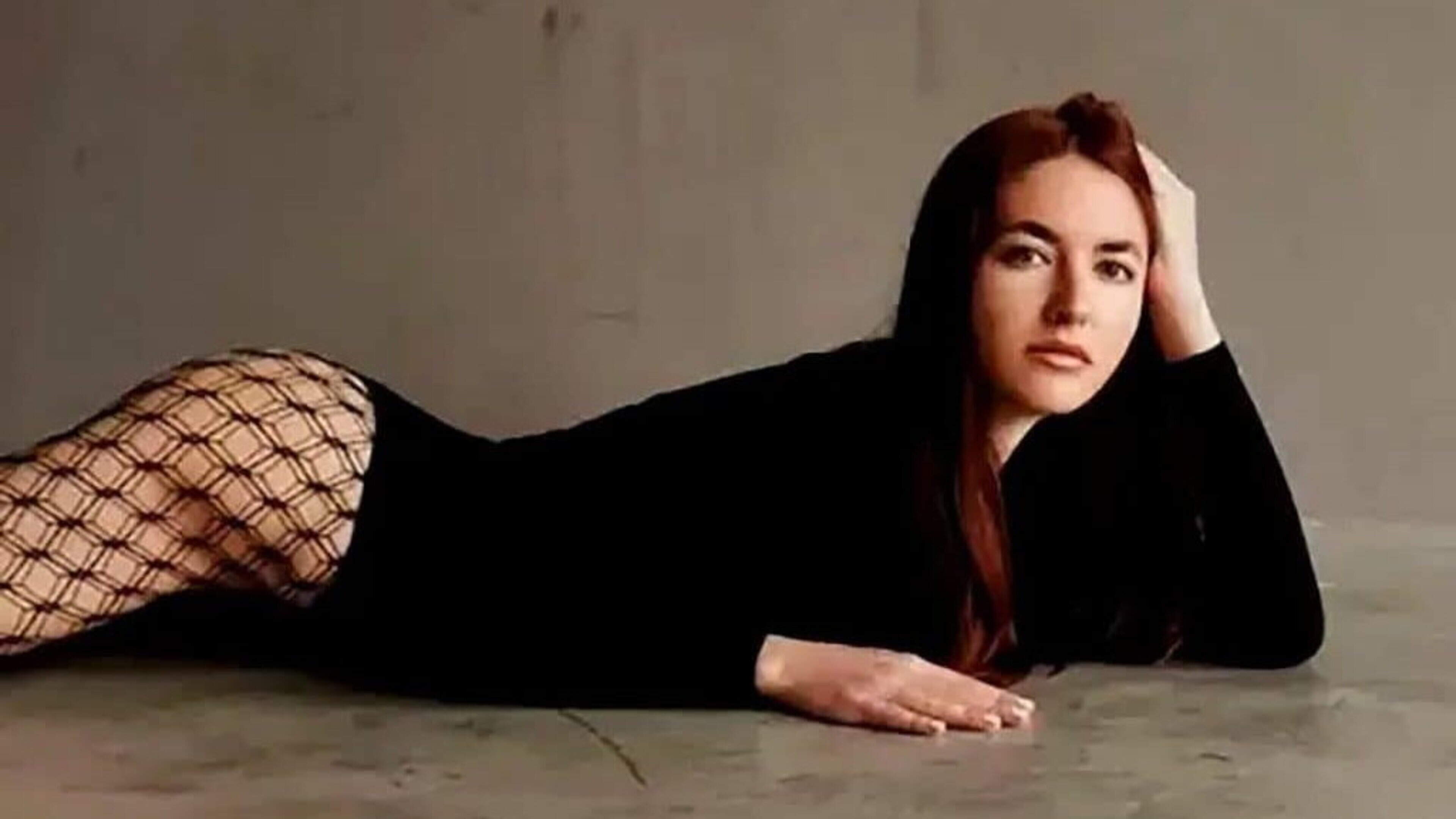 Russian Escort Accused of Assassinating Defector