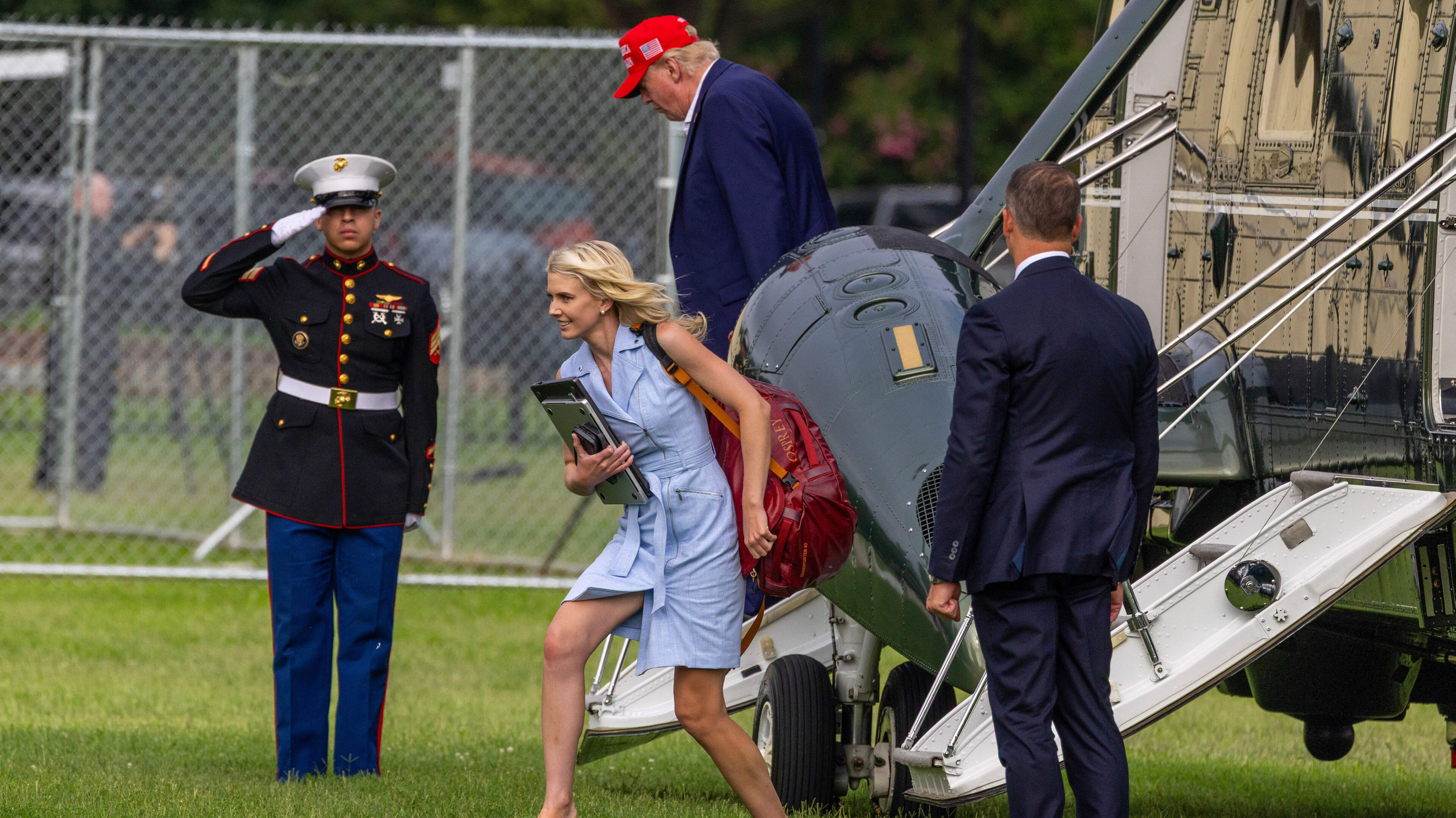 Trump Aide Climbs SUV Boot for Motorcade Seat