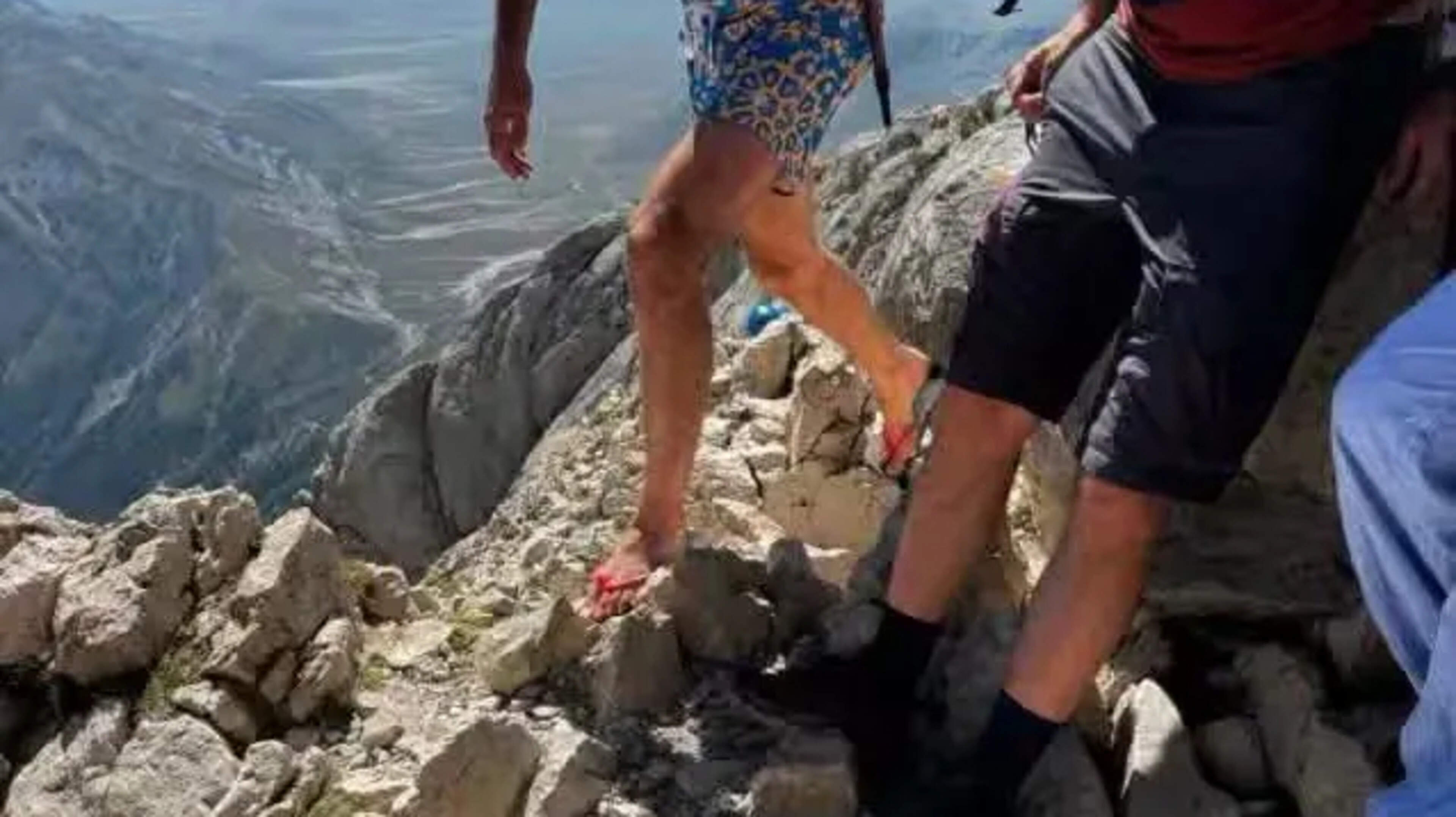 Climber Scales Mountain in Flip-Flops