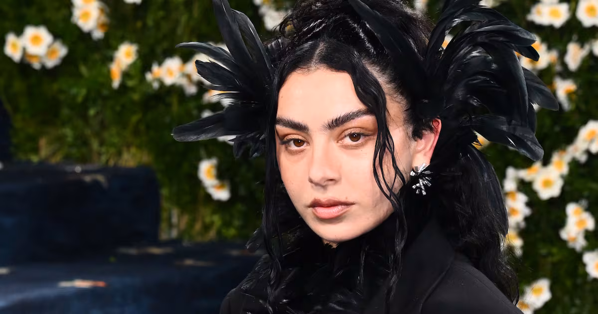Charli XCX Performs at Reading Festival After Rain