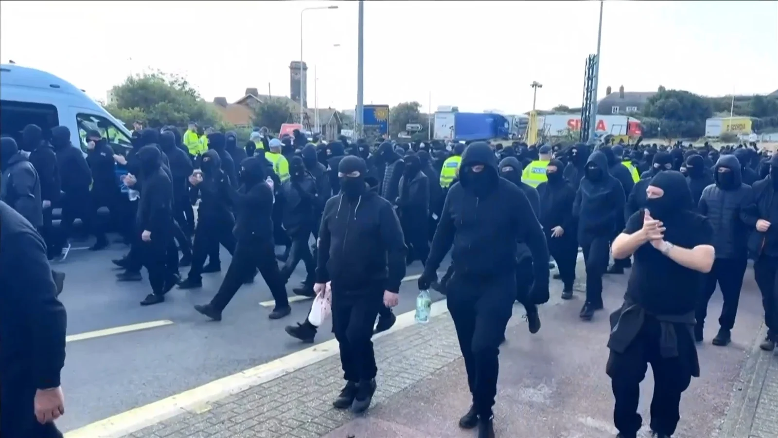 Masked Protesters Block Roads in Dover