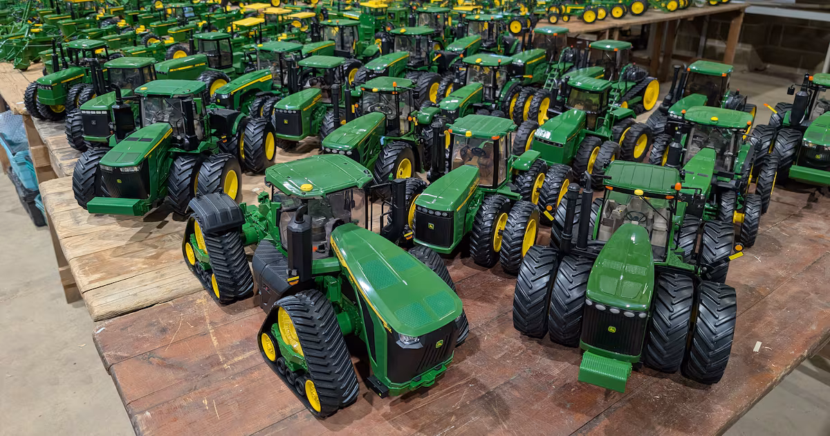Collector selling John Deere tractor toys at auction