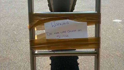 Child injured by glass on playground slide